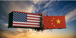 A picture of two shipping containers crashing into each other. One shipping container has the American flag painted on it. The other has the Chinese flag painted on it.