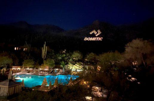 Dometic's logo is projected onto the Catalina Mountains during the opening night of Dometic in the Desert.