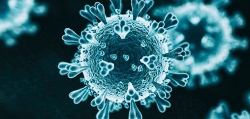a picture of a coronavirus cell illuminated a bluish teal