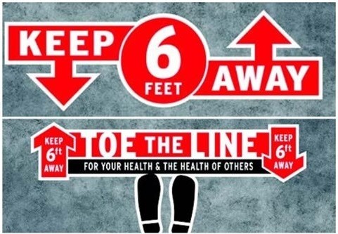 A sign that says "Keep six feet away. Toe the line for your health and the health of others."